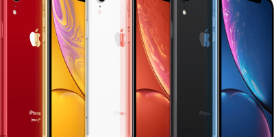 Seis aparelhos iPhone XR, um ao lado do outro, intercalados com a parte traseira e a parte dianteira em destaque. O primeiro aparelho é vermelho, o segundo é dourado, o terceiro é branco, o quarto é rosa, o quinto é preto e o sexto é azul. O fundo da imagem é branco.